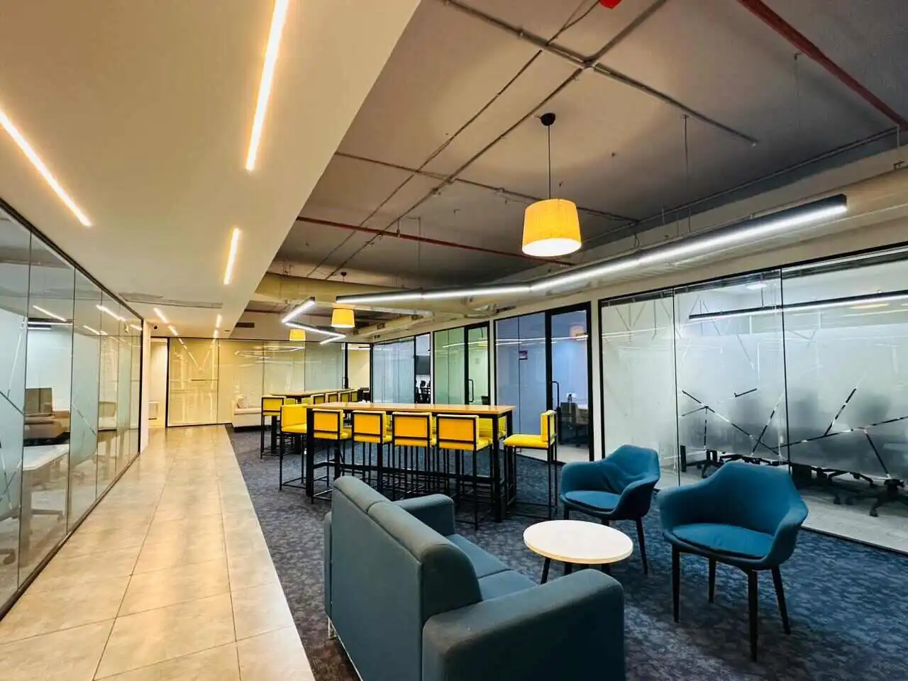 premium office lounge with seating area meeting rooms and modern interior design