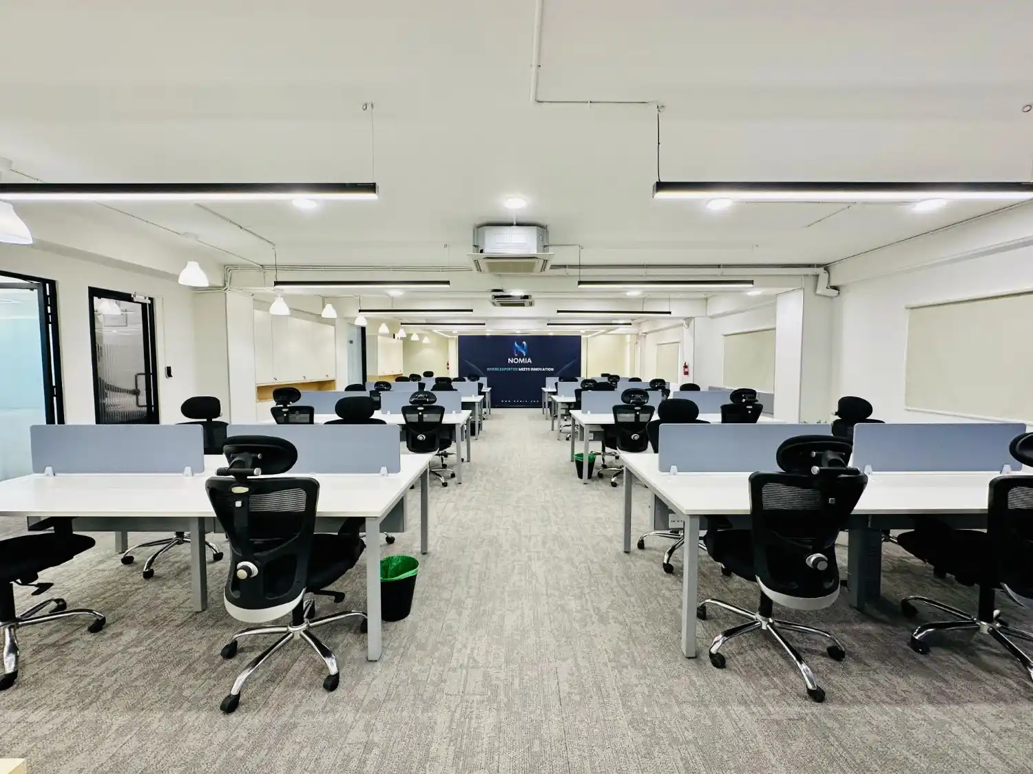Premium managed office interior in Whitefield with modern lighting and collaborative workspace design